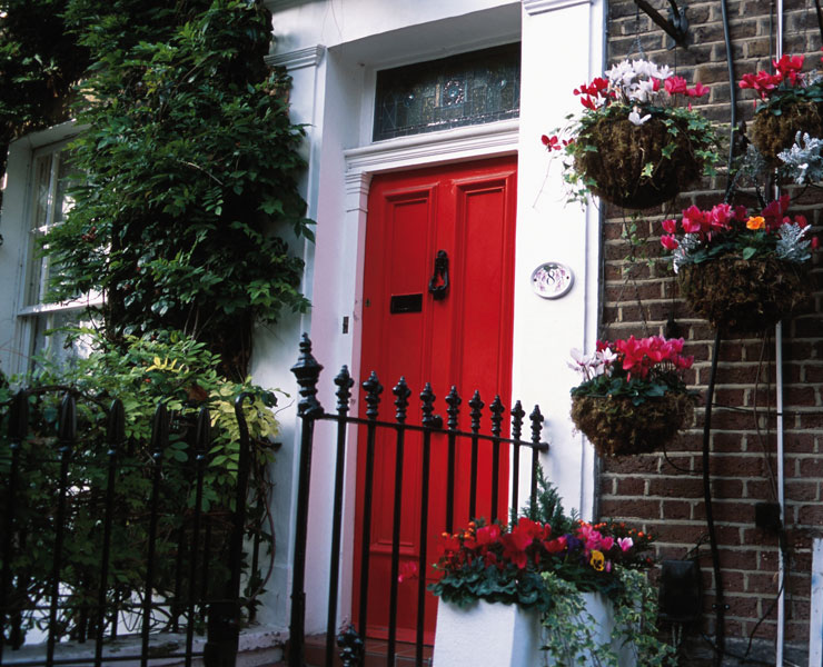 House with red front door and hanging baskets - Propensity to claim motor and house insurance